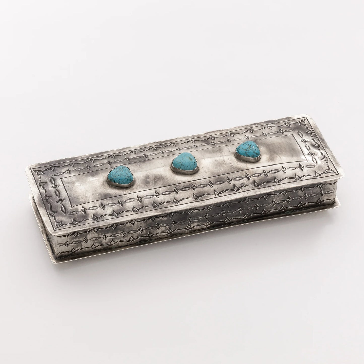 LONG STAMPED BOX WITH THREE TURQUOISE STONES